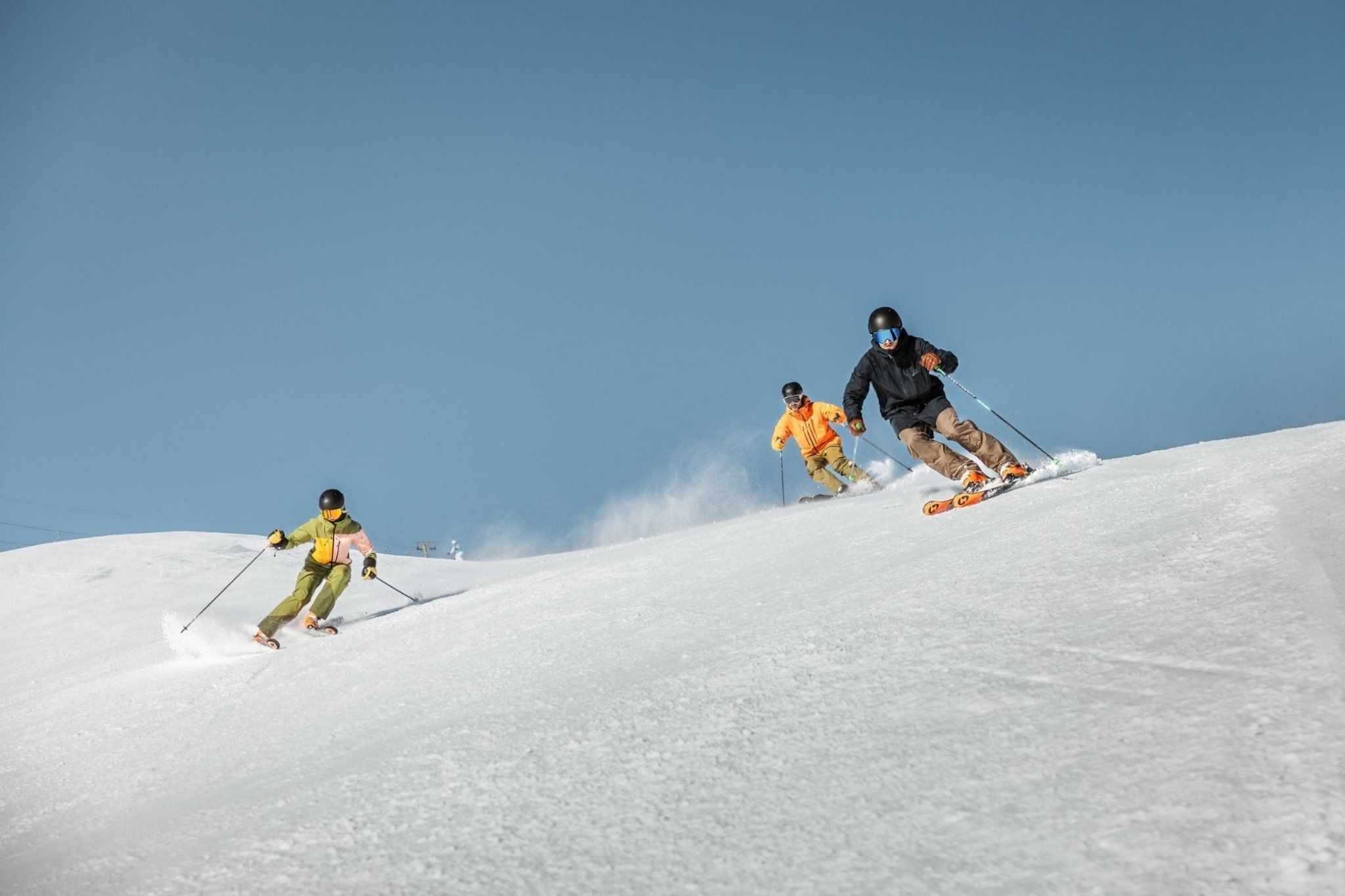 Group Skiing on a groomed run in Venet ski resort 